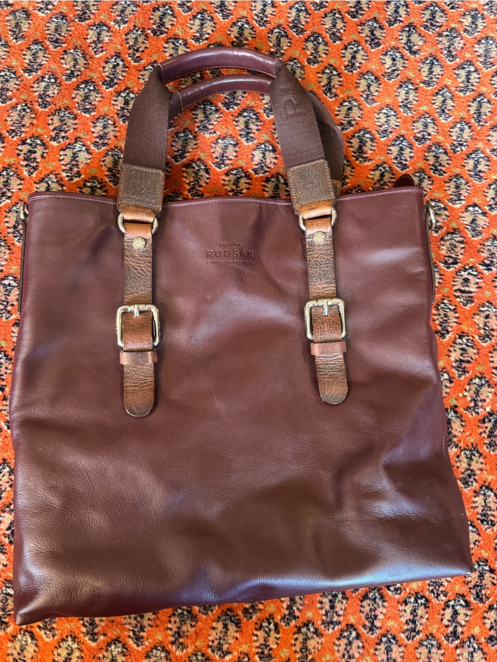 RUDSAK burgundy & Brown Leather Tote with Buckle Strap Details